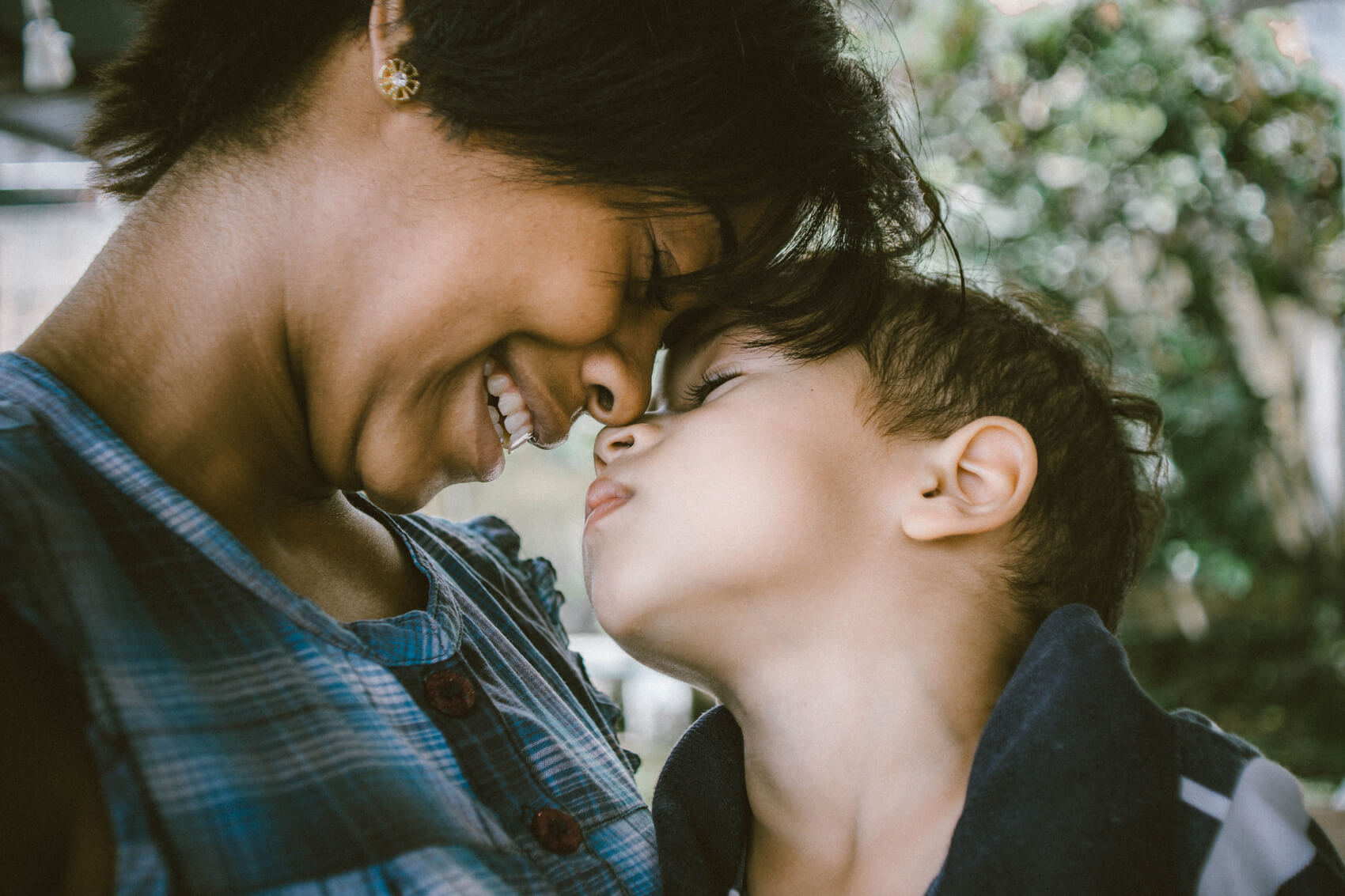 A mother smiling at her son
